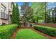 Private backyard oasis with manicured lawn and lush greenery at 3663 Brookhaven Manor Crossing Ne, Atlanta, GA 30319