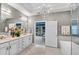 Bright bathroom showcasing double vanities, decorative chandelier, and a view into the adjoining bedroom at 3663 Brookhaven Manor Crossing Ne, Atlanta, GA 30319