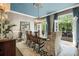Bright dining room with large windows, chandelier, and neutral wallpaper at 3663 Brookhaven Manor Crossing Ne, Atlanta, GA 30319