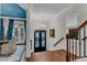 Bright foyer with hardwood floors, a decorative front door, and stylish accents at 3663 Brookhaven Manor Crossing Ne, Atlanta, GA 30319