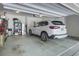 Spacious two-car garage with ample storage space and a modern vehicle at 3663 Brookhaven Manor Crossing Ne, Atlanta, GA 30319