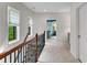 Light-filled hallway with carpet, windows, and views into other rooms at 3663 Brookhaven Manor Crossing Ne, Atlanta, GA 30319