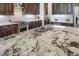 Expansive granite island featuring a double sink, stainless steel appliances, and custom cabinetry at 3663 Brookhaven Manor Crossing Ne, Atlanta, GA 30319
