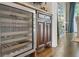 Stylish bar area featuring a Sub-Zero wine fridge, custom cabinetry, and granite countertops at 3663 Brookhaven Manor Crossing Ne, Atlanta, GA 30319