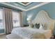 Elegant primary bedroom features a tray ceiling and ample natural light at 3663 Brookhaven Manor Crossing Ne, Atlanta, GA 30319