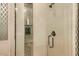 Modern shower with tiled walls, glass door, and built-in shelving offers a sleek and functional design at 3663 Brookhaven Manor Crossing Ne, Atlanta, GA 30319
