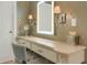 Elegant vanity area with a well-lit mirror, sconces, and a comfortable seating creates a serene space at 3663 Brookhaven Manor Crossing Ne, Atlanta, GA 30319
