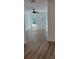 A bright bedroom with sleek, new wood flooring and a modern ceiling fan at 5502 Lakeview Parkway, Villa Rica, GA 30180
