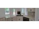 Modern kitchen featuring quartz countertops, stainless steel appliances, custom cabinetry, and large windows at 5502 Lakeview Parkway, Villa Rica, GA 30180