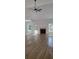 Spacious living room featuring wood floors, a cozy fireplace, lots of natural light, and high ceilings at 5502 Lakeview Parkway, Villa Rica, GA 30180