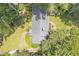 Aerial shot showcasing the roof, backyard, and surrounding lush greenery at 1908 E Roxboro Ne Rd, Atlanta, GA 30324