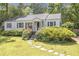 Charming single story home with landscaped front yard and stone walkway at 1908 E Roxboro Ne Rd, Atlanta, GA 30324