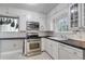 Bright Kitchen with white cabinets and stainless steel appliances at 1908 E Roxboro Ne Rd, Atlanta, GA 30324