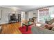 Cozy living room with hardwood floors and comfortable furnishings at 1908 E Roxboro Ne Rd, Atlanta, GA 30324