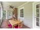Covered back porch with a table and chairs at 1908 E Roxboro Ne Rd, Atlanta, GA 30324