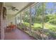 Covered porch with a dining set, offering views of the backyard at 1908 E Roxboro Ne Rd, Atlanta, GA 30324