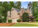 Attractive two-story home with brick and siding, a two-car garage, and mature landscaping at 2759 Thomashire Trce, Marietta, GA 30066