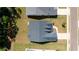 Aerial view of a home with dark shingles, a well-maintained lawn, and a paved driveway at 313 Sobeck Way, Canton, GA 30115