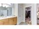 Bathroom featuring double sink vanity and door into large walk-in closet at 313 Sobeck Way, Canton, GA 30115