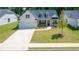 Charming home with a well-manicured lawn, a two-car garage, and a welcoming front porch at 313 Sobeck Way, Canton, GA 30115