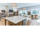 Spacious kitchen island with stone countertops, stainless steel appliances, and open views of the living spaces at 313 Sobeck Way, Canton, GA 30115