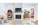 Living room features a stone fireplace, built-in bookshelves, and cozy seating at 313 Sobeck Way, Canton, GA 30115