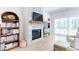 Living room featuring a stone fireplace, built-in bookcase, sliding doors to the outside and modern decor at 313 Sobeck Way, Canton, GA 30115