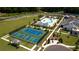 Aerial view of tennis and pickleball courts, a community pool, and clubhouse at 313 Sobeck Way, Canton, GA 30115