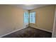 Bedroom featuring neutral walls, carpeted floors, and a window at 3646 Salem Dr, Lithonia, GA 30038