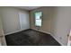 Cozy bedroom with carpet, a window, and a closet at 3646 Salem Dr, Lithonia, GA 30038