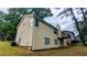 Exterior view showcasing the back of the home, yard, and deck at 3646 Salem Dr, Lithonia, GA 30038