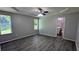 Bright Primary bedroom featuring a tray ceiling, two windows and a view into ensuite bathroom at 1513 Foxhall Se Ln, Atlanta, GA 30316