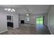 Open living area with sliding glass doors, a fireplace, and an open view of the modern kitchen at 1513 Foxhall Se Ln, Atlanta, GA 30316