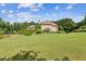 Expansive backyard with lush landscaping offers ample space and a picturesque view of the home at 317 Red Gate Overlook, Canton, GA 30115