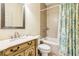 Well-maintained bathroom with a shower-tub combo and classic vanity cabinet at 317 Red Gate Overlook, Canton, GA 30115