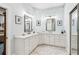 Well-lit bathroom with double sinks, marble floors, and ample counter space at 317 Red Gate Overlook, Canton, GA 30115