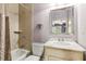 Cozy bathroom featuring a shower-tub combo and a classic vanity with marble countertop at 317 Red Gate Overlook, Canton, GA 30115