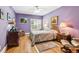 Charming bedroom with hardwood floors, a ceiling fan, and tasteful decor at 317 Red Gate Overlook, Canton, GA 30115