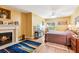 Comfortable bedroom featuring a cozy fireplace and a ceiling fan for relaxing at 317 Red Gate Overlook, Canton, GA 30115