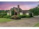 Charming single-story home with stone accents, manicured landscaping, and a spacious driveway at 317 Red Gate Overlook, Canton, GA 30115