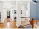 Elegant foyer with hardwood floors, white columns, and a view of the staircase and front door at 317 Red Gate Overlook, Canton, GA 30115