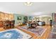 Spacious living room with hardwood floors, a bar, and multiple seating areas at 317 Red Gate Overlook, Canton, GA 30115