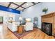 Bright and airy living room featuring hardwood floors, a fireplace, and a large rug at 317 Red Gate Overlook, Canton, GA 30115