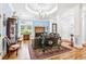 Charming living room featuring hardwood floors, a fireplace, and elegant decor creating a warm atmosphere at 317 Red Gate Overlook, Canton, GA 30115