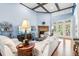 Inviting living room with coffered ceilings, hardwood floors, and a cozy fireplace at 317 Red Gate Overlook, Canton, GA 30115