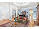 Bright and spacious living room featuring hardwood floors, elegant furniture, and classic interior design at 317 Red Gate Overlook, Canton, GA 30115