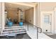 Covered patio with seating, stylish decor, and a convenient ramp for easy access to the outdoors at 317 Red Gate Overlook, Canton, GA 30115