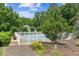 Beautiful fenced pool area with lush landscaping creating a private and serene outdoor retreat at 317 Red Gate Overlook, Canton, GA 30115