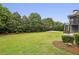 Beautiful backyard with a basketball court and lush landscaping, ideal for outdoor activities at 3705 Williams Point Dr, Cumming, GA 30028