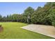 Well-maintained backyard with basketball court and batting cage, perfect for sports enthusiasts at 3705 Williams Point Dr, Cumming, GA 30028